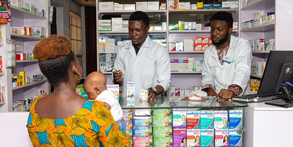 Mom and baby at a Nigerian pharmacy