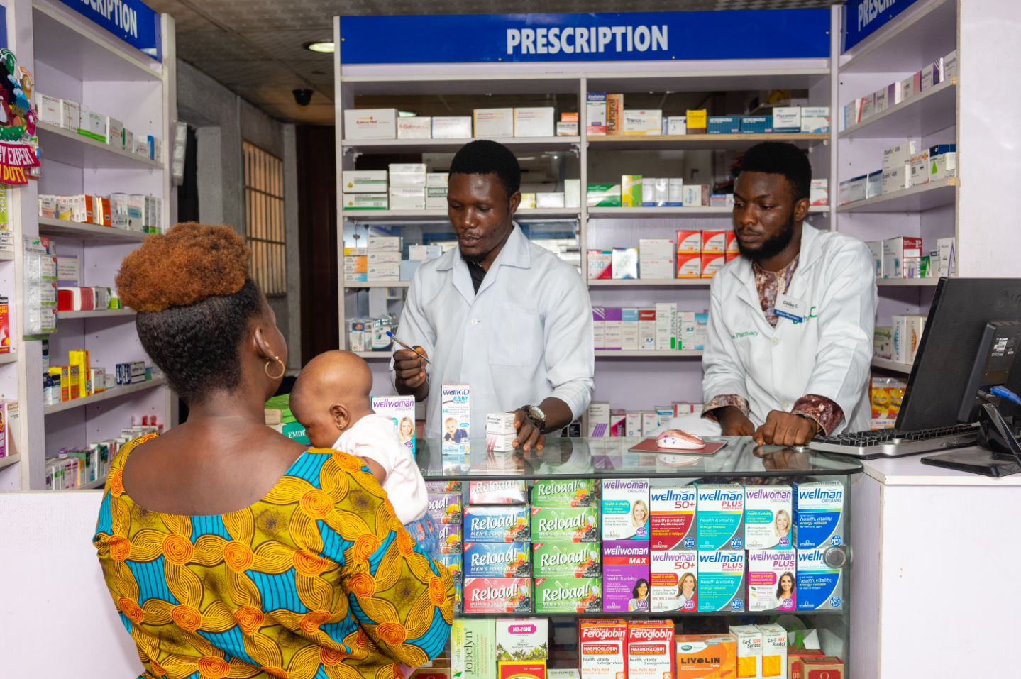 Women and baby at Nigerian pharmacy